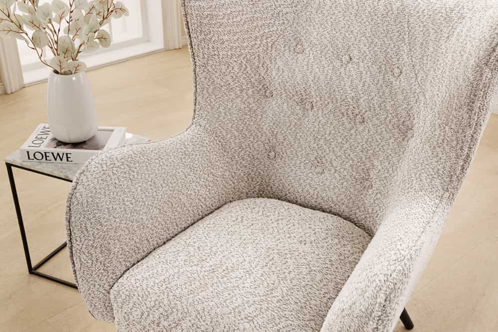 Wing chair AMSTERDAM bouclé greige black metal legs