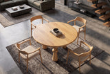 Dining table ARTE 120cm round sculptural legs mango wood natural