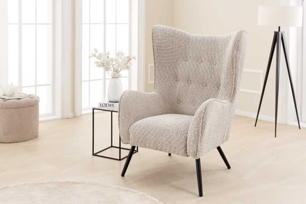 Wing chair AMSTERDAM bouclé greige black metal legs