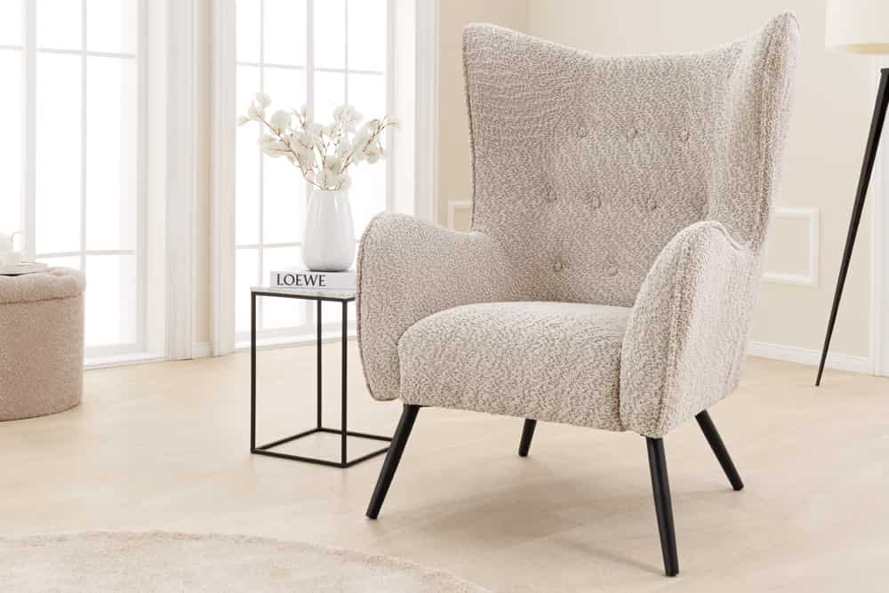 Wing chair AMSTERDAM bouclé greige black metal legs